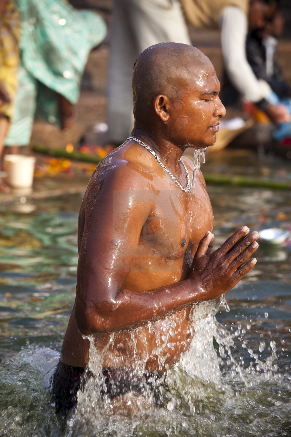 Indian Hindu Pilgrims Bathing In The Ganges River At Dashashwamedh Ghat 